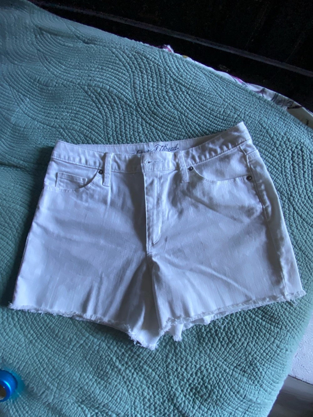 Universal White Denim Cutoff Shorts with Frayed Hem